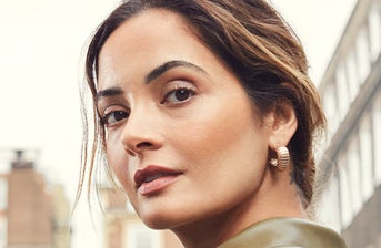 Dots showing anti-wrinkle injection points on a woman's face